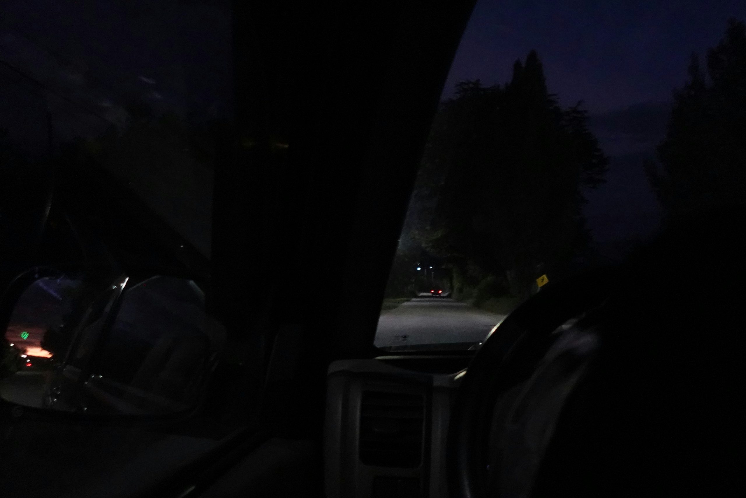 This image shows driving on a dark road at night.